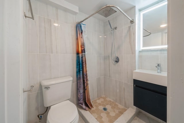 bathroom with a shower with shower curtain, vanity, toilet, and tile walls