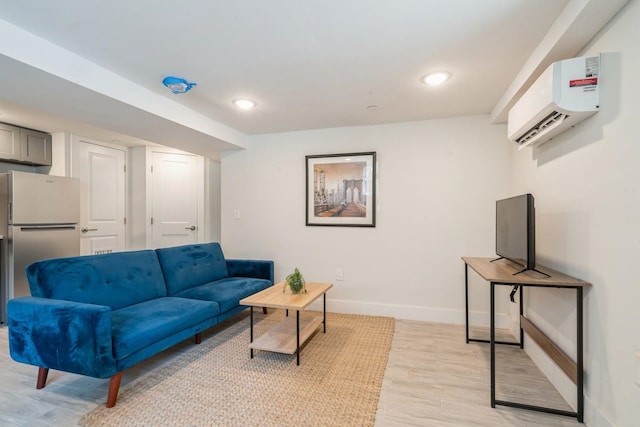 living room featuring light hardwood / wood-style floors and an AC wall unit