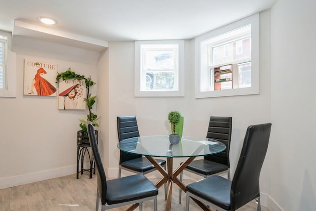 dining area with light hardwood / wood-style floors