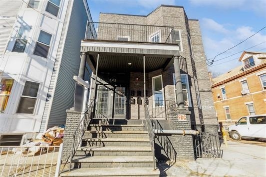 view of property with a balcony