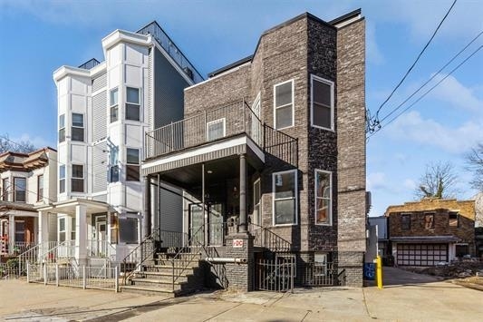 view of front of property with a balcony