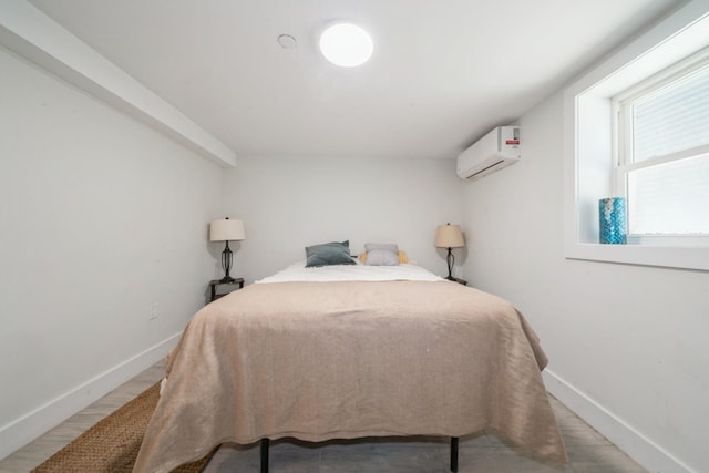 bedroom featuring a wall mounted air conditioner