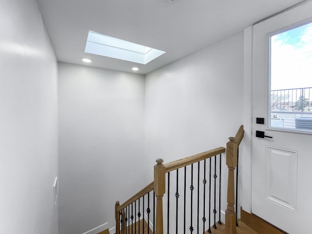 285 Lembeck Ave Unit 1, Jersey City, NJ 07305 - stairs with baseboards, recessed lighting, a skylight, and wood finished floors