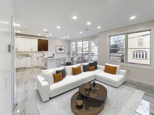 285 Lembeck Ave Unit 1, Jersey City, NJ 07305 - living area featuring visible vents, baseboards, marble finish floor, and recessed lighting