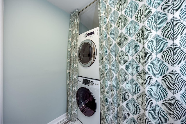 washroom with laundry area and stacked washer and clothes dryer