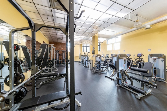 workout area featuring a drop ceiling