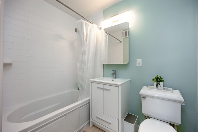 bathroom with vanity, toilet, visible vents, and shower / bath combo with shower curtain