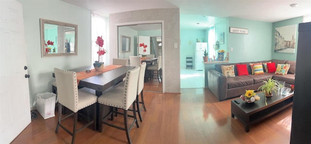 dining area featuring hardwood / wood-style flooring and plenty of natural light