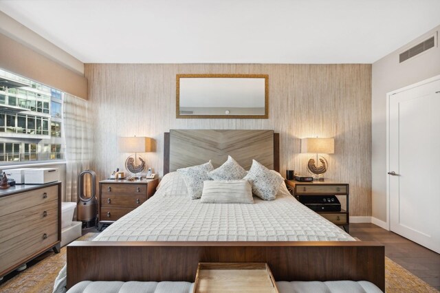 bedroom featuring dark wood-type flooring