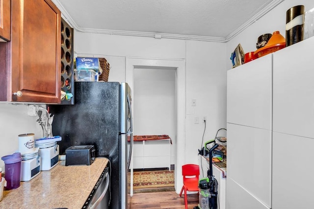 6414 Park Ave Unit 14, West New York, NJ 07093 - kitchen with wood finished floors, ornamental molding, and light countertops