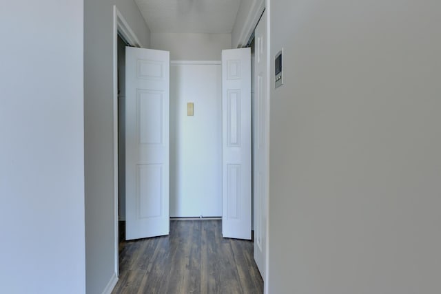 1011 Harmon Cv Unit 1011, Secaucus, NJ 07094 - hallway with dark wood-style flooring, baseboards, and a textured ceiling