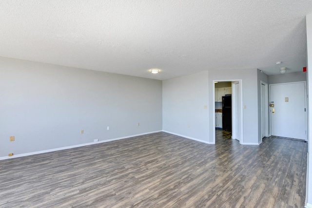 1011 Harmon Cv Unit 1011, Secaucus, NJ 07094 - spare room featuring dark wood-style floors, a textured ceiling, and baseboards