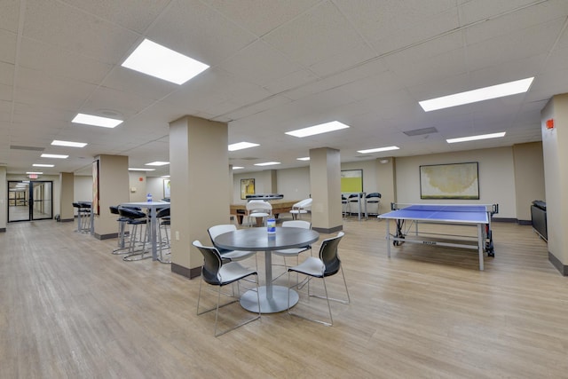 1011 Harmon Cv Unit 1011, Secaucus, NJ 07094 - rec room featuring light wood-style flooring, baseboards, and a paneled ceiling
