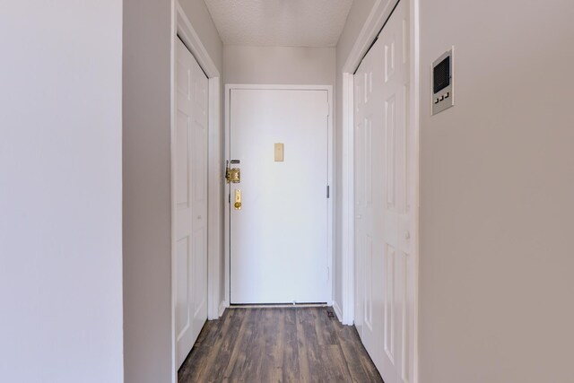 1011 Harmon Cv Unit 1011, Secaucus, NJ 07094 - doorway to outside with dark wood-type flooring and a textured ceiling