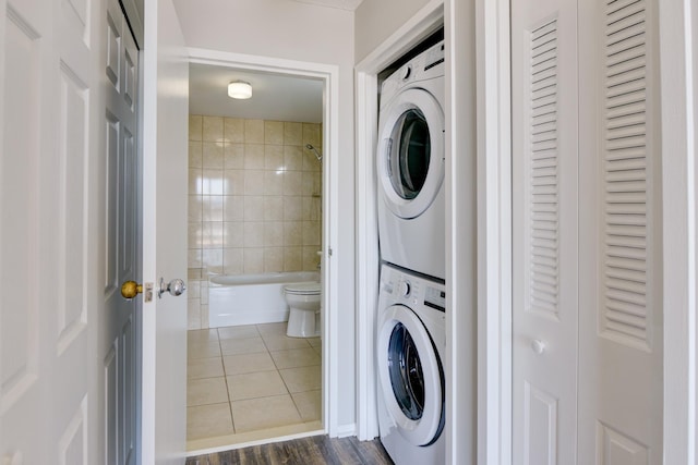1011 Harmon Cv Unit 1011, Secaucus, NJ 07094 - washroom with stacked washing machine and dryer and dark tile patterned flooring