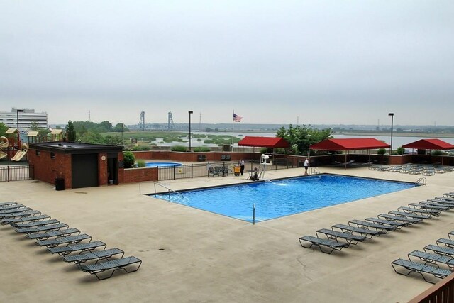 1011 Harmon Cv Unit 1011, Secaucus, NJ 07094 - community pool featuring a patio area
