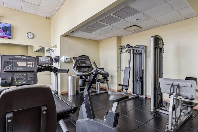 exercise room with a drop ceiling