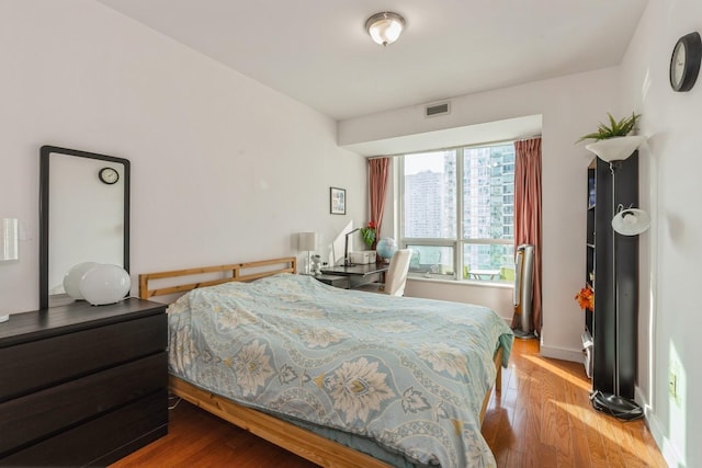 bedroom featuring wood-type flooring