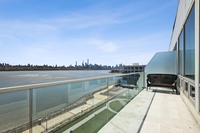 balcony featuring a water view