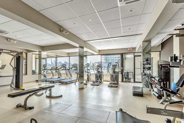 exercise room with a drop ceiling