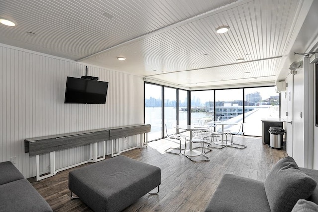 living room featuring hardwood / wood-style flooring and floor to ceiling windows