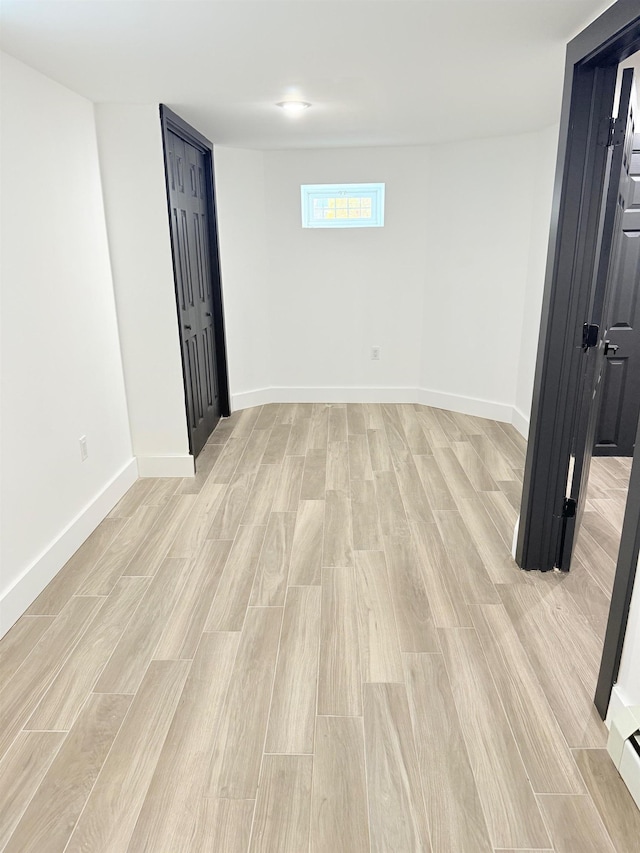 530 45th St, Union City, NJ 07087 - below grade area with light wood-type flooring and a baseboard heating unit