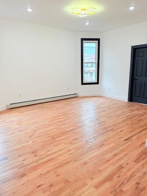 530 45th St, Union City, NJ 07087 - empty room featuring a baseboard radiator, light wood finished floors, and recessed lighting