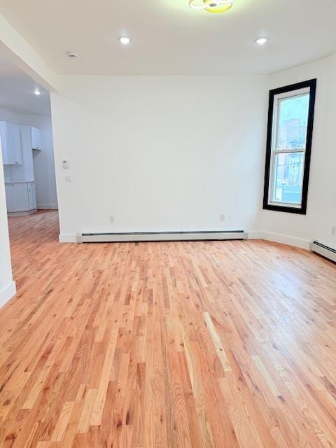530 45th St, Union City, NJ 07087 - spare room with light wood-type flooring, recessed lighting, a baseboard radiator, and baseboard heating