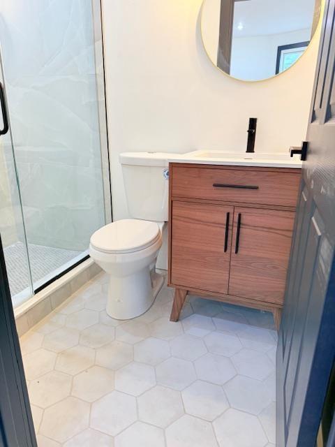 530 45th St, Union City, NJ 07087 - bathroom featuring vanity and a shower stall