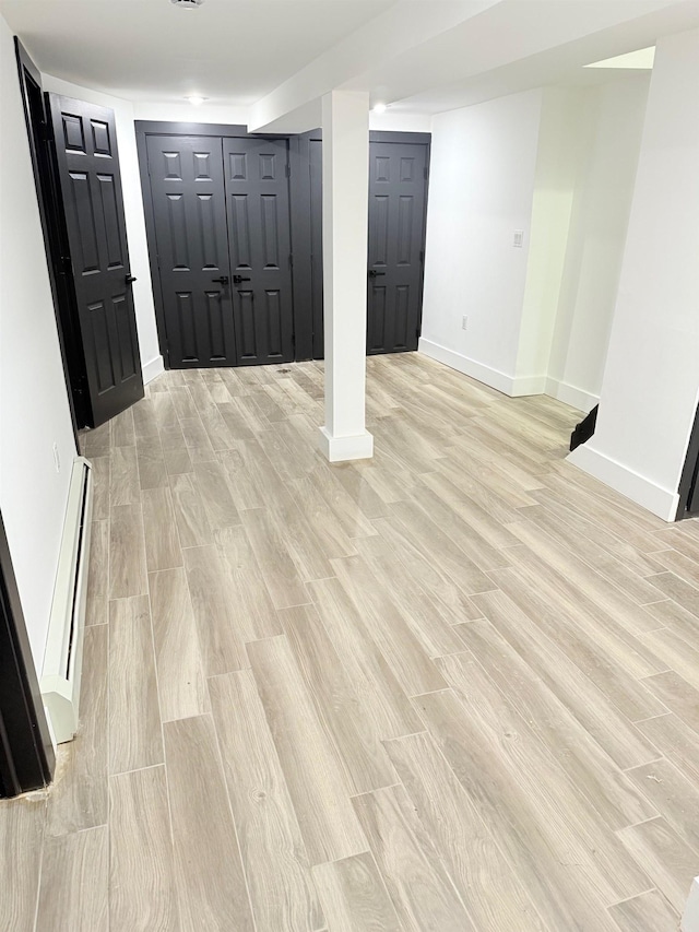 530 45th St, Union City, NJ 07087 - foyer entrance with light wood-type flooring and a baseboard heating unit