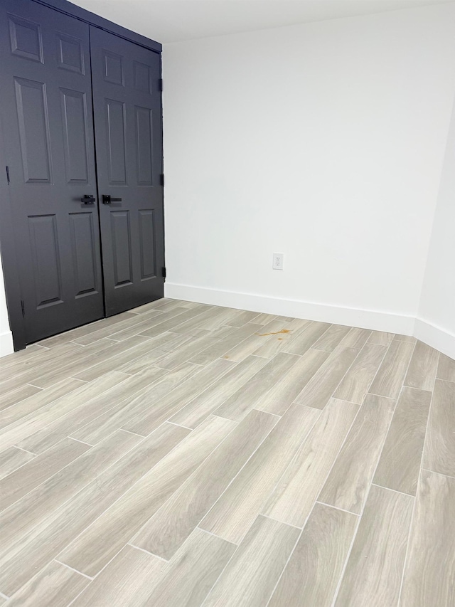530 45th St, Union City, NJ 07087 - unfurnished bedroom with light wood finished floors and a closet