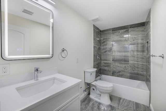 full bathroom featuring toilet, bathing tub / shower combination, visible vents, and vanity