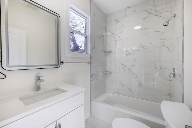 bathroom featuring marble finish floor, shower / tub combination, vanity, and toilet