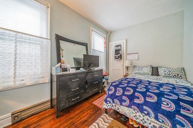 bedroom featuring dark hardwood / wood-style flooring