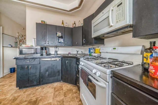 kitchen with sink and white appliances