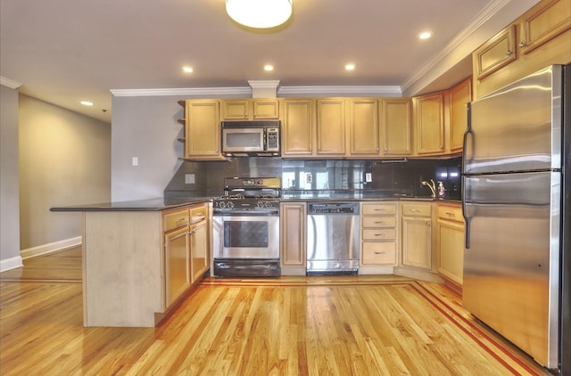 kitchen featuring dark countertops, backsplash, appliances with stainless steel finishes, and a peninsula