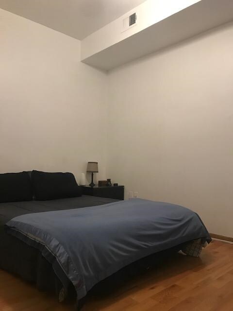 bedroom featuring hardwood / wood-style flooring