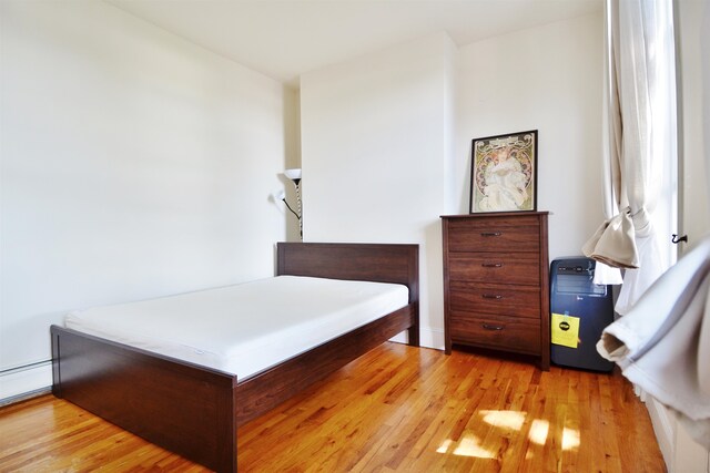 bedroom featuring light hardwood / wood-style floors