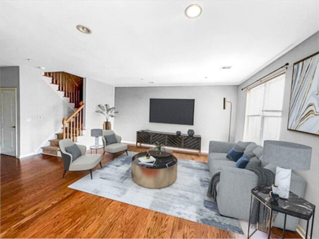 living room featuring stairway, wood finished floors, recessed lighting, and baseboards