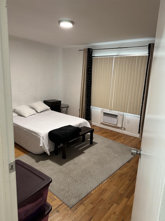 186 Highlands Ave Unit 5A, Clifton, NJ 07011 - bedroom with an AC wall unit and wood finished floors