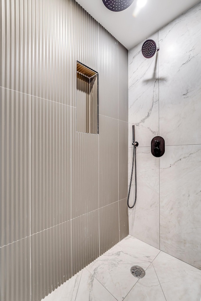 full bathroom with a tile shower