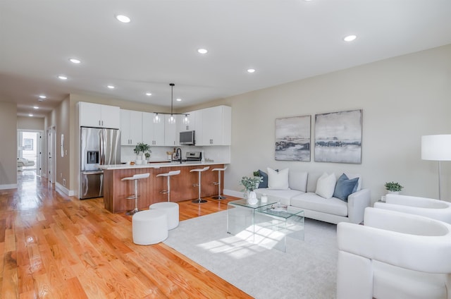 275 Pearsall Ave Unit 2, Jersey City, NJ 07305 - living area featuring baseboards, light wood-style flooring, and recessed lighting