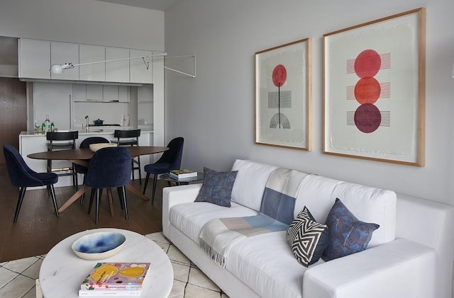 living room featuring light wood-type flooring and sink