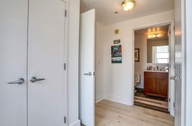 88 Morgan St Unit 2206, Jersey City, NJ 07302 - hall with light wood-style flooring and baseboards