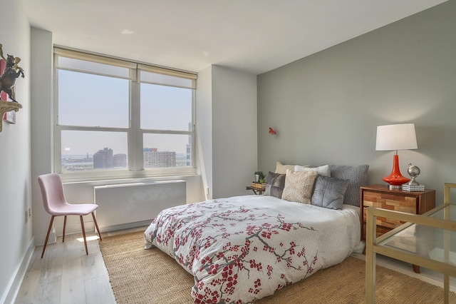88 Morgan St Unit 2206, Jersey City, NJ 07302 - bedroom featuring wood finished floors and baseboards