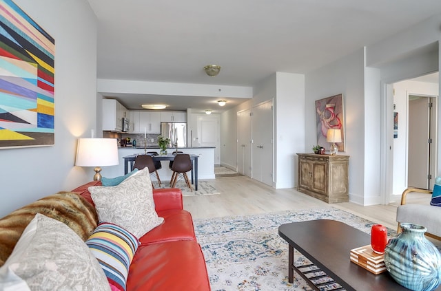 88 Morgan St Unit 2206, Jersey City, NJ 07302 - living room featuring light wood-style floors and baseboards