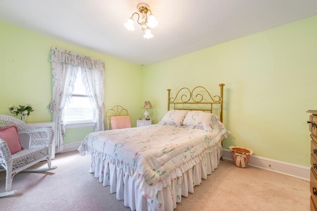 532 Passaic Ave, Nutley, NJ 07110 - bedroom featuring light carpet, baseboards, and a chandelier