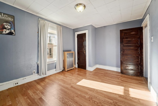 empty room with light hardwood / wood-style flooring