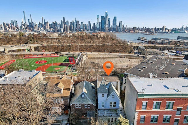 birds eye view of property with a water view