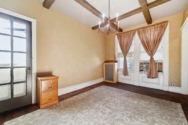 interior space featuring cooling unit, dark hardwood / wood-style floors, a chandelier, beam ceiling, and coffered ceiling